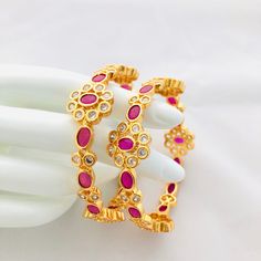 "CZ Bangles,CZ/AD Bangles,Bridal Bangles,Sabyasachi Cubic Zirconia American diamond bangles,Indian Jewelry, Kemp Bangle, Kada Bangles @AryaFashions in size 2.4, 2.6,2.8 This bangles set is handcrafted with love and creativity and are perfect for any occasion may it be engagement, Wedding or any bridal ceremonies or social get-together. These handcrafted beautiful high quality bangles are made in brass alloy metal with traditional Jadau handwork and are lined with fine lustrous stones. Pair them Round Temple Jewelry Bangle With Stone Setting, Temple Jewelry Style Round Bangle With Stone Setting, Festive Round Bangle With Stone Setting, Ruby Jeweled Bangle For Wedding, Jeweled Round Bangle For Anniversary, Festive American Diamond Round Bangle, Hand Set Ruby Round Bangle, Bollywood Style Jeweled Round Bangle, Diamond Bangles Indian