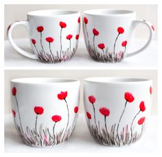 three coffee mugs with red flowers painted on the inside and outside of each cup