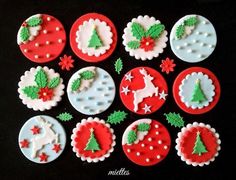 twelve decorated cookies arranged in the shape of christmas trees and snowflakes on a black surface