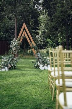 an outdoor ceremony set up with chairs and flowers