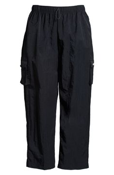 Cargo pockets and a relaxed fit give your off-duty look a utilitarian finishing touch in woven sweatpants finished with an adjustable drawcord waist. 29 1/2" inseam; 19" leg opening; 12 1/2" front rise; 17" back rise (size Medium) 100% nylon Machine wash, tumble dry Imported Off Duty, Nike Sportswear, Cargo Pants, Sweatpants, Nordstrom, Relaxed Fit, Black White, Size Medium, Black And White