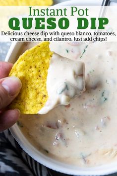 a hand dipping a tortilla chip into a bowl of quesadilla dip