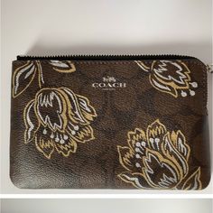 Coach Wristlet Corner Zip Colors:Brown/Gold Metallic Gold Flowers Print Non Smoking Home . New With Tags. Brown Rectangular Coach Coin Purse, Coach Rectangular Brown Coin Purse, Brown Wristlet With Removable Pouch As Gift, Brown Coach Clutch With Removable Pouch, Coach Brown Clutch With Removable Pouch, Brown Coach Pouch Clutch, Brown Wristlet With Zipper Pouch For Gift, Brown Pouch Wristlet As Gift, Brown Wristlet With Zipper Pouch As Gift