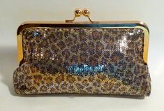 Beautiful Leopard sequined clutch.   It comes with a gold and gold frame.Lining can be changed to your custom color.Fabric: sequined fabricLining: satinTwo layers of interlining and battingSilver/nickel kisslock frameTop Width 8"Bottom Width 9"Height 5 1/2"Reinforced stitching for durability*Note:  A chain can be added for $4.00.  Please see my chain listing.*The metal purse frame is made of iron with a nickel-free finish.  It's hypoallergenic, itch and rash resistant for people with nickel sens Gold Sequin Clutch For Events, Glamorous Gold Sequined Clutch, Gold Sequin Clutch For Parties, Gold Sequined Clutch For Party, Metal Purse, Purse Frame, Metallic Purse, Bridal Clutch, Color Fabric