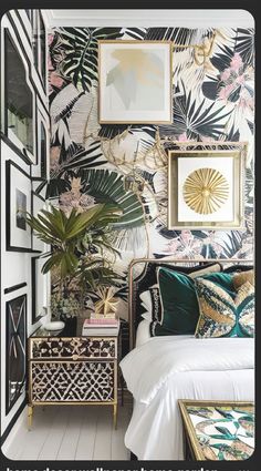 a bedroom with tropical wallpaper and gold accents