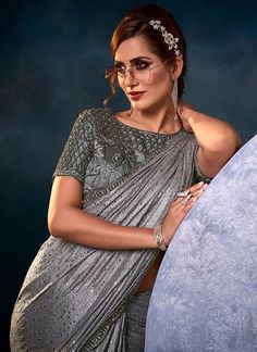 Silver Grey Festive Saree Diwali Silver Pre-draped Saree With Mirror Work, Bollywood Style Embellished Festive Pre-draped Saree, Traditional Embellished Pre-draped Saree For Festive Season, Embroidered And Embellished Fabric For Designer Wear During Navratri, Silver Pre-draped Saree With Mirror Work For Diwali, Festive Pre-draped Sequined Dola Silk Saree, Silver Semi-stitched Pre-draped Saree For Designer Wear, Silver Blouse Piece With Mirror Work For Reception, Silver Pre-draped Saree With Mirror Work