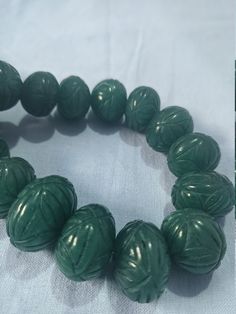 15'' Emerald Beryl AA+ 961 Carat Fine Quality Emerald Pumpkin 18-22mm Beads Gemstone adjustable cord Necklace Stone : emerald beryl Shape :- fancy Pumpkin Necklace - 15 inch 1 line string Size :- 18mm to 22mm Weight :- 961 carat Polish :- Handmade color - green makes a great gift for your loved ones. It is known as the 'love stone' as the message it emits is the strong vibration of unconditional love, joy, warmth and healing. As quartz crystals are profound amplifiers of energy, it may help to k Adjustable Carved Round Beads Jewelry, Pumpkin Beads, Pumpkin Necklace, Pumpkin Bead, Carnelian Bracelet, Gem Shop, Necklace Stone, 108 Bead, Quartz Crystals