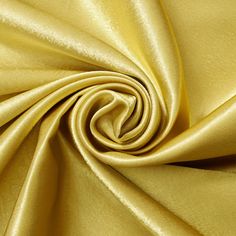 a close up shot of a gold satin fabric