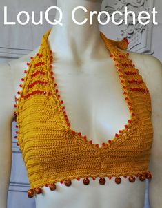 This hand crocheted top is made from 100% cotton in a mustard colour with red beading on top and a row of red and wooden beads along the bottom. This top ties at the neck and back bikini style and is perfectly suitable for swimming in or casual wear . Adjustable ties make it suitable for a range of sizes depending on how you like to wear it though recommend for cup size c+. Yellow Halter Neck Top For Festival, Handmade Yellow Crochet Top For Beach, Yellow Summer Crochet Top For Festival, Yellow Halter Neck Crop Top For The Beach, Summer Festival Yellow Crochet Top, Red Halter Neck Crop Top For The Beach, Yellow Sleeveless Crochet Top For Festivals, Sleeveless Yellow Crochet Top For Festival, Handmade Yellow Tops For Beach