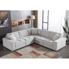 a living room with a sectional couch and rug