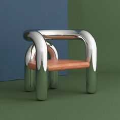 a chair made out of metal and wood with an unusual design on the back side