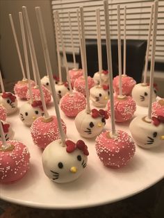 hello kitty cake pops are arranged on a plate