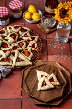 some pies are sitting on a table with sunflowers and other food items