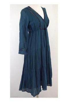 Size 6 Teal Cotton Peasant Dress Made in USA 100% Cotton Long sleeves Bronze button cuffs Shimmer surplice neckline detail Shoulder to hem 42" Fitted V-neck Peasant Dress, Bohemian Long Sleeve Tiered Summer Dress, Bohemian Long Sleeve Tiered Dress With Ruffle Hem, Peasant Style Midi Dress For Fall, Bohemian Tiered Dress With Smocked Cuffs, Surplice Neckline, Peasant Dress, Dress Making, Made In Usa