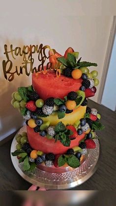 there is a cake that has fruit on it