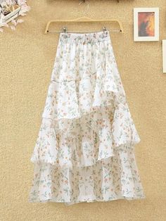 Material: PolyesterStyle: CasualOrigin: CN(Origin)Fabric Type: BlendedWaistline: Natural FactorsPattern Type: PrintSilhouette: Ball GownDresses Length: Mid-CalfDecoration: NONEGender: WOMENpattern: FloralSource type: SpotSkirt type: Irregular skirtsize: S M L XL 2XLstyle: Fresh and sweetSkirt length: Middle-skirtFabric: ChiffonSuitable age: 18-45 years oldSkirt category: skirt White Tiered Skirt For Spring, Spring Mini Skirt With Layered Hem, White Skirt With Layered Hem, Summer Asymmetrical Maxi Skirt With Ruffle Hem, White Chiffon Skirt For Spring, Non-stretch Ruffled Maxi Skirt, White Ruffled Maxi Skirt For Brunch, White Long Skirt With Ruffle Hem, White Flowy Skirt With Layered Hem