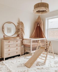 a baby's room with a crib, dresser and bed