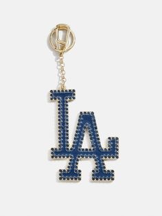 a los angeles dodgers keychain with the word la on it in blue and gold