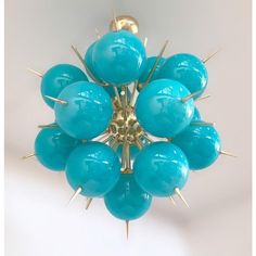 a bunch of blue balls with spikes on them