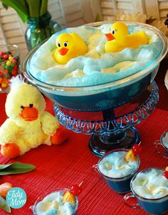 there are several pictures of bath time with rubber ducks in the tub and cupcakes on the table