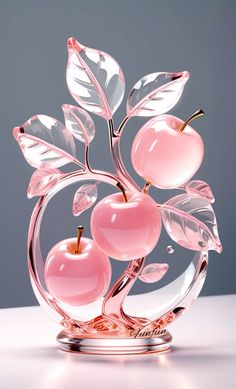 a pink apple sculpture sitting on top of a table