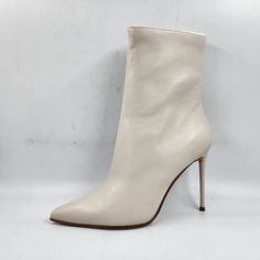 Aqua Gal Pointed High Heel Booties Women's 9.5m Bone Functional Inside Zipper Aqua Gal Pointed High Heel Booties Women's 9.5m Bone Functional Inside Zipper Retail $158.00 Elevate Your Fashion Game With These Aqua Gal Pointed High Heel Booties. The Bone-Colored Booties Come In A Modern Design With A Pointed Toe Shape And Ultra-High Stiletto Heel Style. The Functional Inside Zipper Ensures Easy Wear, While The Manmade Outsole Material And Rubber Insole Material Provide Comfort. These Booties Are P Spring Almond Toe Boots With Red Sole, Pointed Toe Heels With Zipper Closure, Beige High Heel Boots With Zipper, Chic Ankle-high Booties With 4-inch Heel, Chic Ankle-high Booties With Padded Heel, White Booties With Reinforced Heel And Pointed Toe, Chic White Ankle-high Booties, White Ankle-high Party Booties, Beige Pointed Toe Boots With Zipper Closure