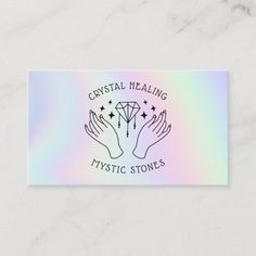 a business card with two hands holding a crystal stone in front of a rainbow background