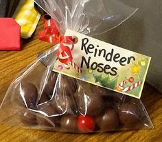 a bag filled with chocolate candies sitting on top of a wooden table