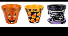 three halloween cups with faces on them and words trick or treat written on the sides