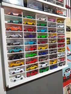 a display case filled with lots of toy cars