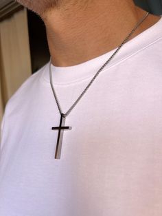 Men's Cross Pendant Necklace is a durable silver-colored box chain made of hypoallergenic stainless steel. A great choice as a gift for him. Dimensiones: Cruz - altura 45 mm, ancho 24 mm, espesor 4,2 mm; Cadena - espesor 2 mm, largo a elegir. To choose the length of the necklace: 1. Prepare a thread and a ruler. 2. Take a thread of the desired necklace length. 3. Try it on in front of a mirror to see how it will look on your neck. 4. Unwind the thread and measure its length with a ruler. Following these steps, you can accurately determine a comfortable and stylish necklace length. Features: - Material: hypoallergenic stainless steel. - Design: classic rope chain. - Durability: Resistant to tarnishing, corrosion, and daily wear. - Comfort: Suitable for sensitive skin due to hypoallergenic p Best Gifts For Him, Mens Crosses, Cross Chain, Stylish Necklace, Men's Necklace, Cross Pendant Necklace, Color Box, Chains For Men, Box Chain