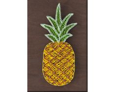 a decorative pineapple on a brown background