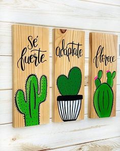 three wooden signs with cactuses and the words se fuerte, chocolate, flore