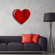 a living room with a couch, lamp and red heart cut out on the wall