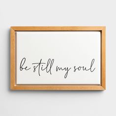 a framed print with the words be still my soul in black ink on white paper