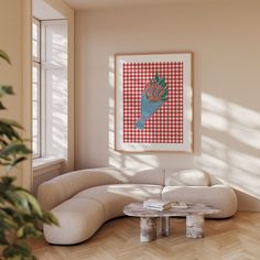 a living room with a couch, coffee table and potted plant in the corner