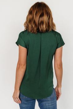 Lightweight and flowy material Deep Hunter Green color Single notched narrow lapel Button front Dropped cap sleeve Rounded, hi-low shirttail hemline Self: 100% Polyester Marianne is 5'6, cup size 34D, size 6 and wearing size S Hunter Green Color, Drop Cap, Baltic Born, Button Top, Cup Size, Hunter Green, Summer Top, Cap Sleeve, Green Color