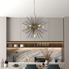 a modern kitchen with grey cabinets and marble counter tops, an island table surrounded by blue chairs