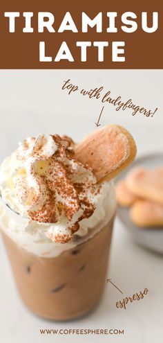 a close up of a cup of coffee with whipped cream