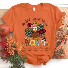 an orange t - shirt with a turkey on it and the words happy thanksgiving grandma