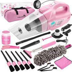 the pink vacuum is packed with cleaning supplies