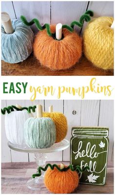 crocheted pumpkins are sitting on a table next to a sign that says easy yarn pumpkins