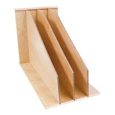 a wooden shelf with three sections cut out