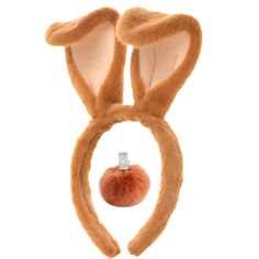 a bunny ears headband with an orange pom - pom on the side