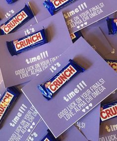 many purple candy bars are stacked on top of each other with the words crunch written on them