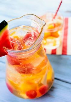 a pitcher filled with watermelon and lemonade