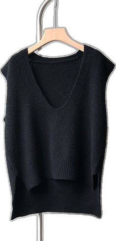 Chic Black Knit Vest, Black V-neck Knitted Sweater Vest, Black Knitted V-neck Sweater Vest, Black Knitted Sweater Vest For Layering, Black V-neck Tank Top For Layering, Black Stretch V-neck Sweater Vest, Black Knitted Sleeveless Tops, Black Knitted Sleeveless Sweater Vest, Chic Black Tank Top For Winter