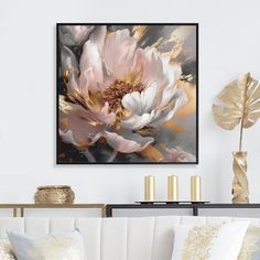 a living room scene with focus on the couch and large floral painting above it's head