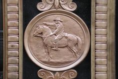 a plaque with a horse and rider on it