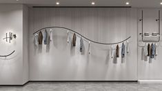 an empty room with clothes hanging on the wall